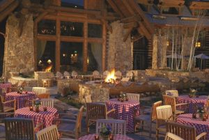 Checked tablecloths, casual flowers and candles create a Western/mountain feel. Courtesy of The Ritz-Carlton, Bachelor Gulch.
