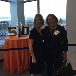 Beth Buehler and Destination Colorado President and Hotel Boulderado General Manager Lisa Lindgren by the Lombardi Trophy.